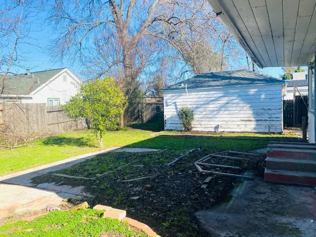 a view of a backyard with a yard