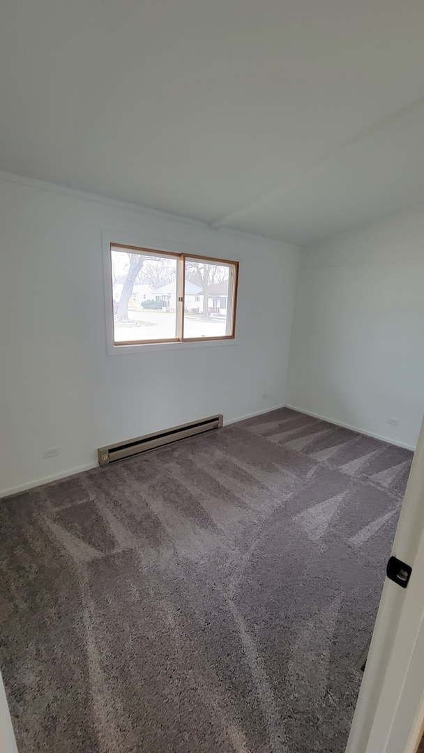 146 Center Street Seneca, IL 61360 - Photo 13 of 19 an empty room with a window