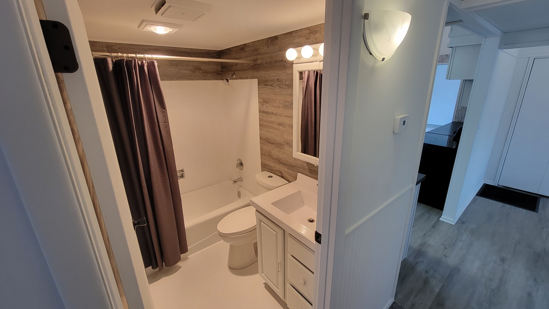 146 Center Street Seneca, IL 61360 - Photo 14 of 19 a bathroom with a shower toilet and sink