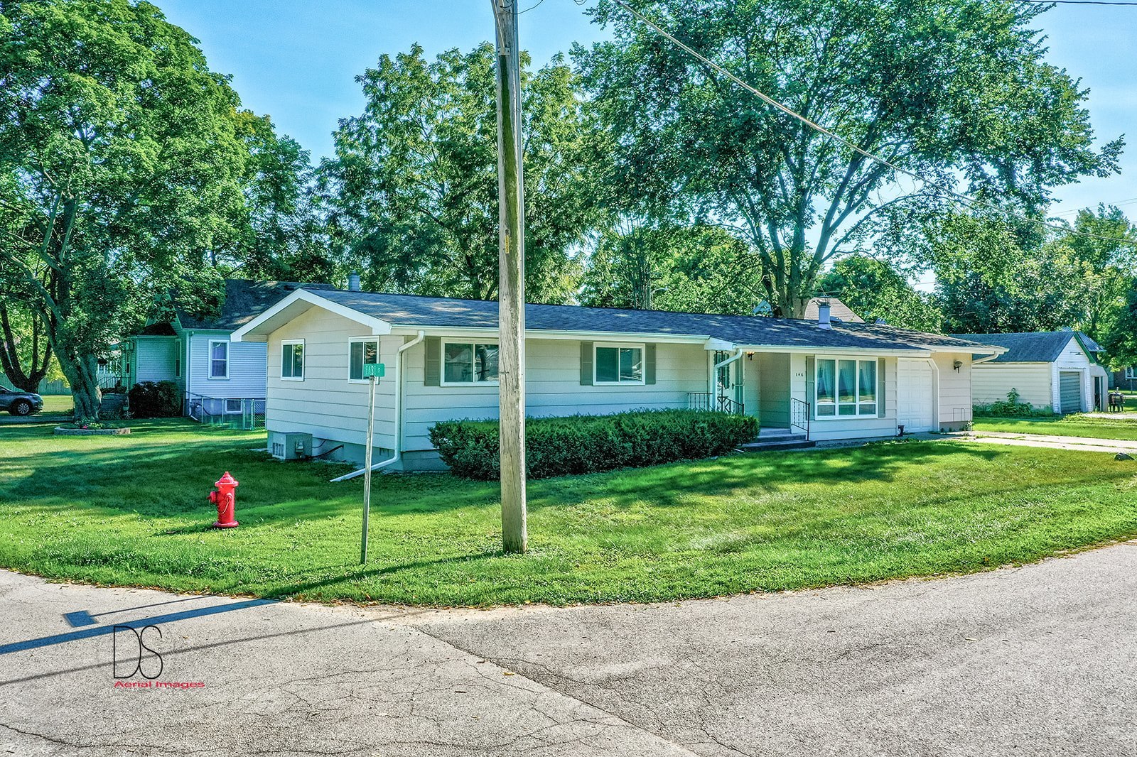 146 Center Street Seneca, IL 61360 - Photo 19 of 19 a view of a house with a backyard and a tree