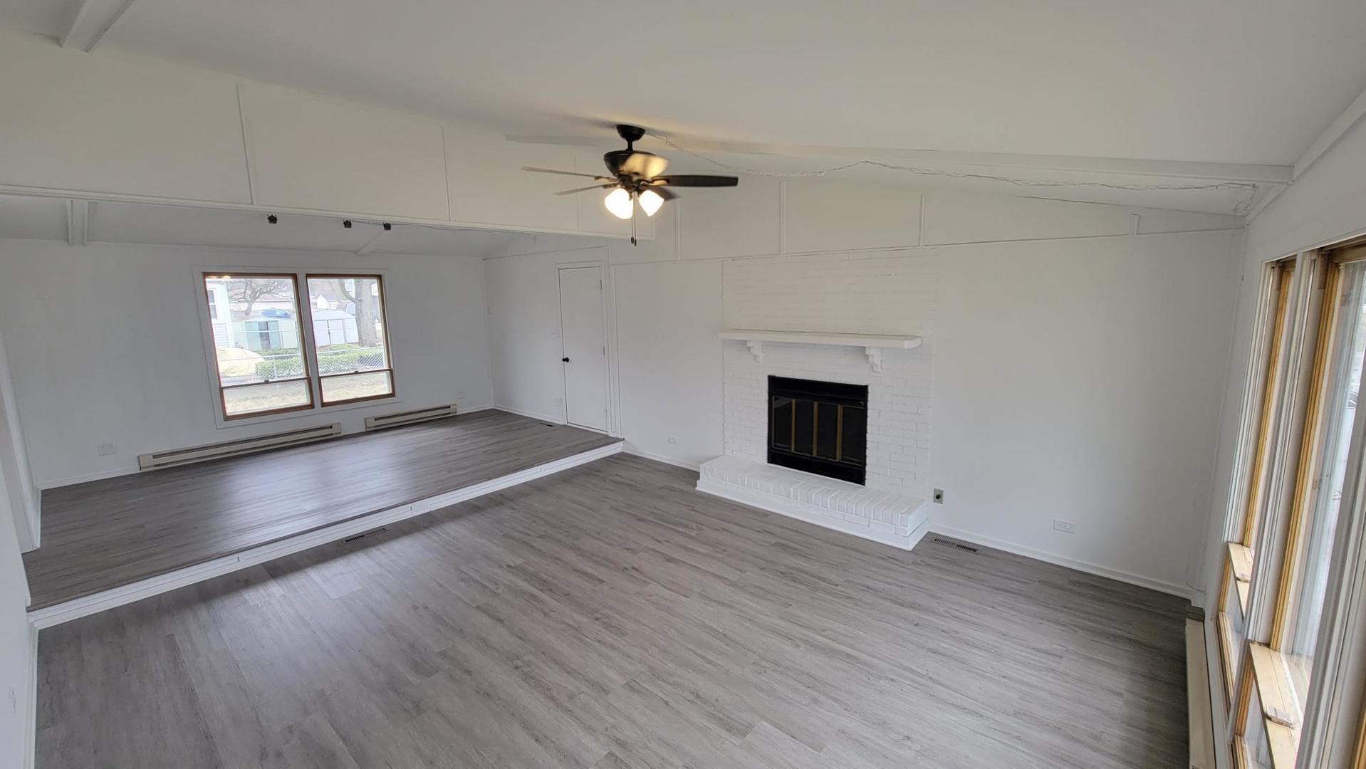 146 Center Street Seneca, IL 61360 - Photo 7 of 19 wooden floor in an empty room with a window