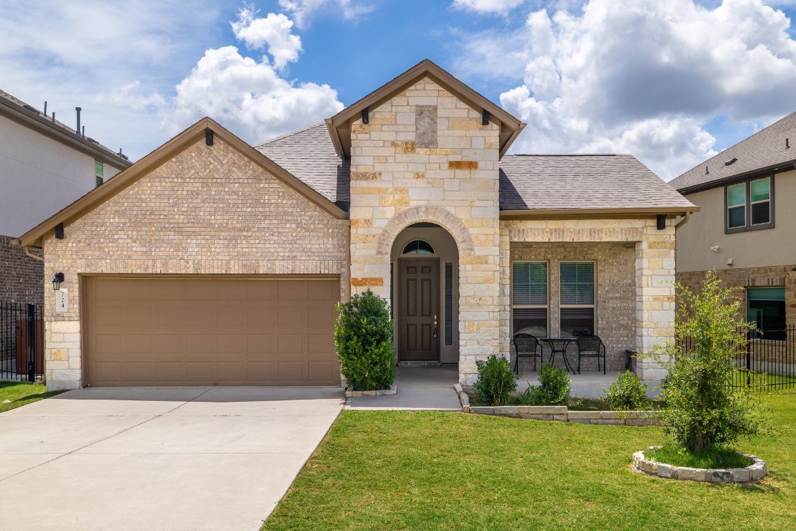 724 Kingston Place Cedar Park, TX 78613 - Photo 1 of 1 a front view of a house with a yard and garage