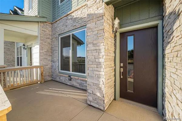 a view of front door of house with window