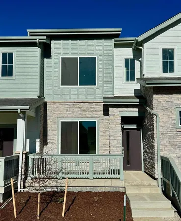 a white building with a bench in front of it