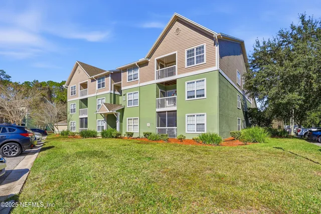 a front view of building with yard