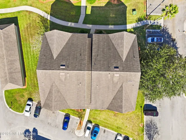 aerial view of a house with swimming pool and porch