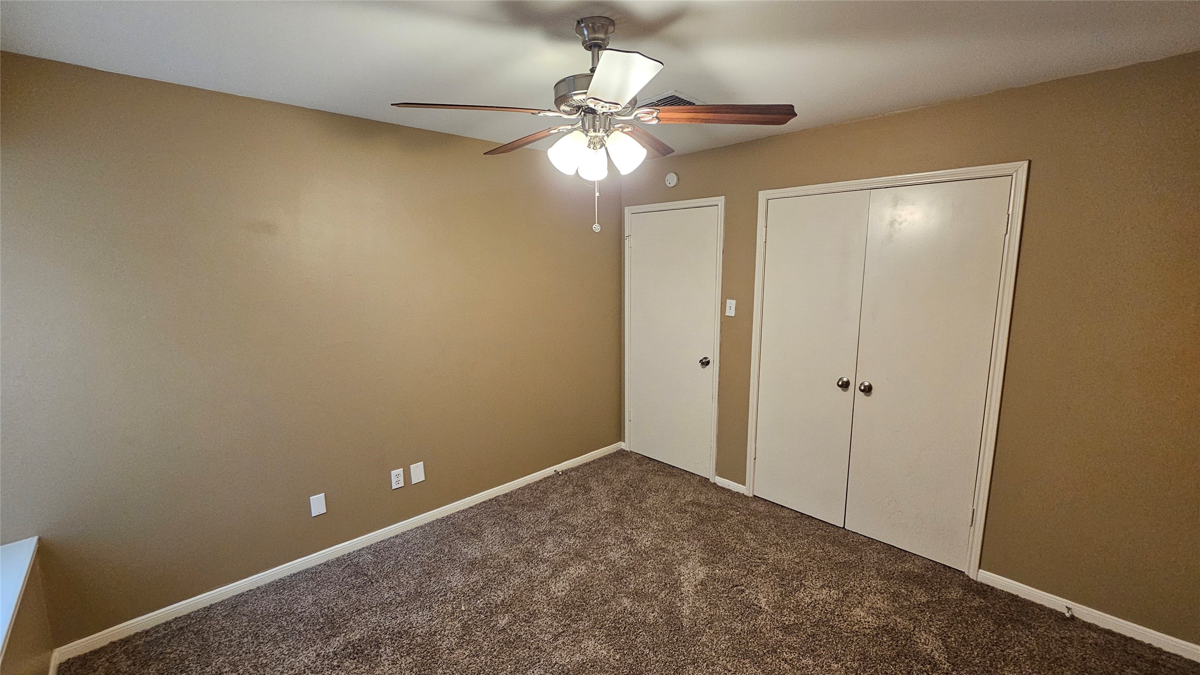 14807 Spring Lake Drive Houston, TX 77070 - Photo 13 of 21 a view of a chandelier fan and closet in a room