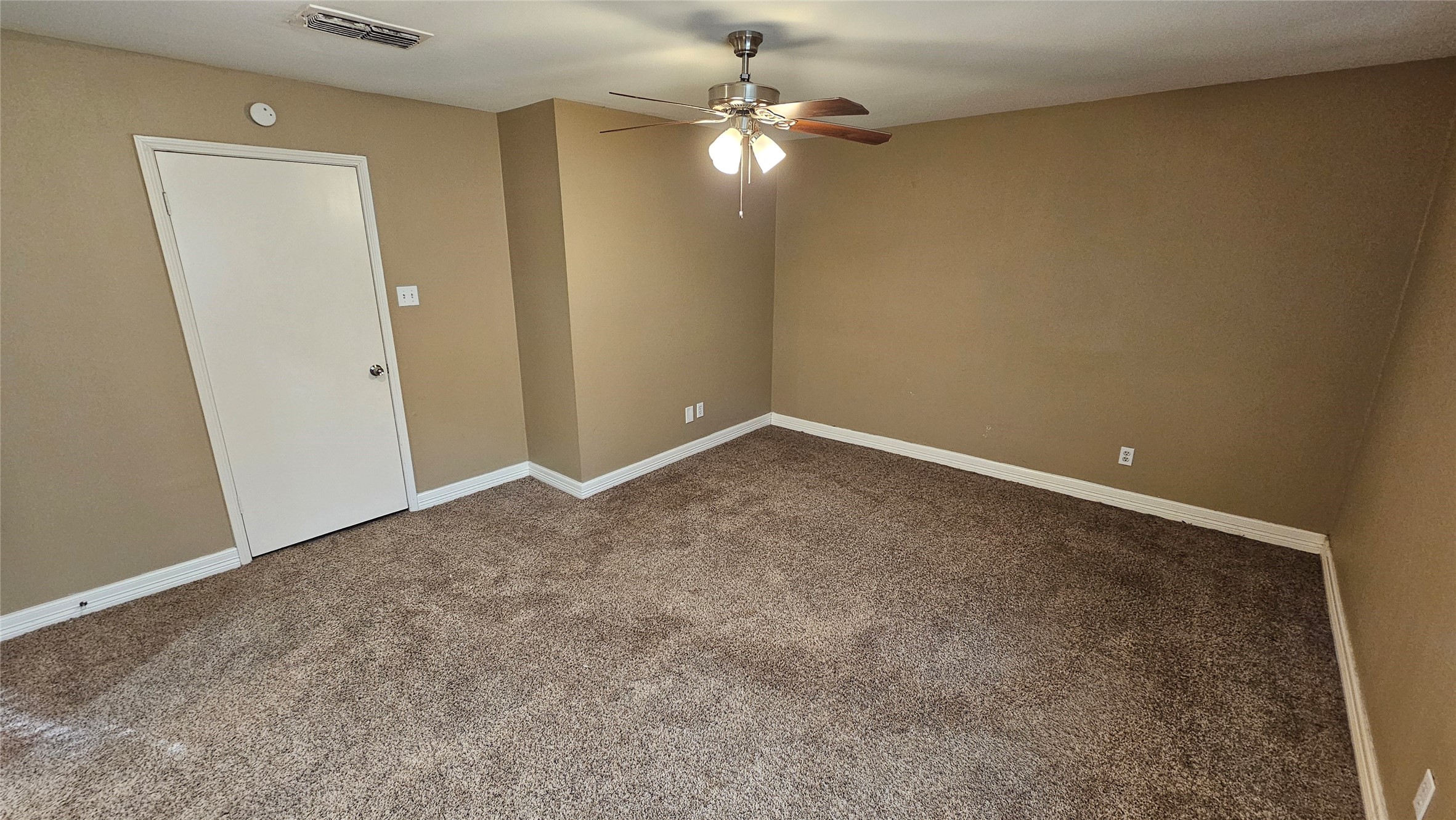 14807 Spring Lake Drive Houston, TX 77070 - Photo 15 of 21 an empty room with a fan & a window