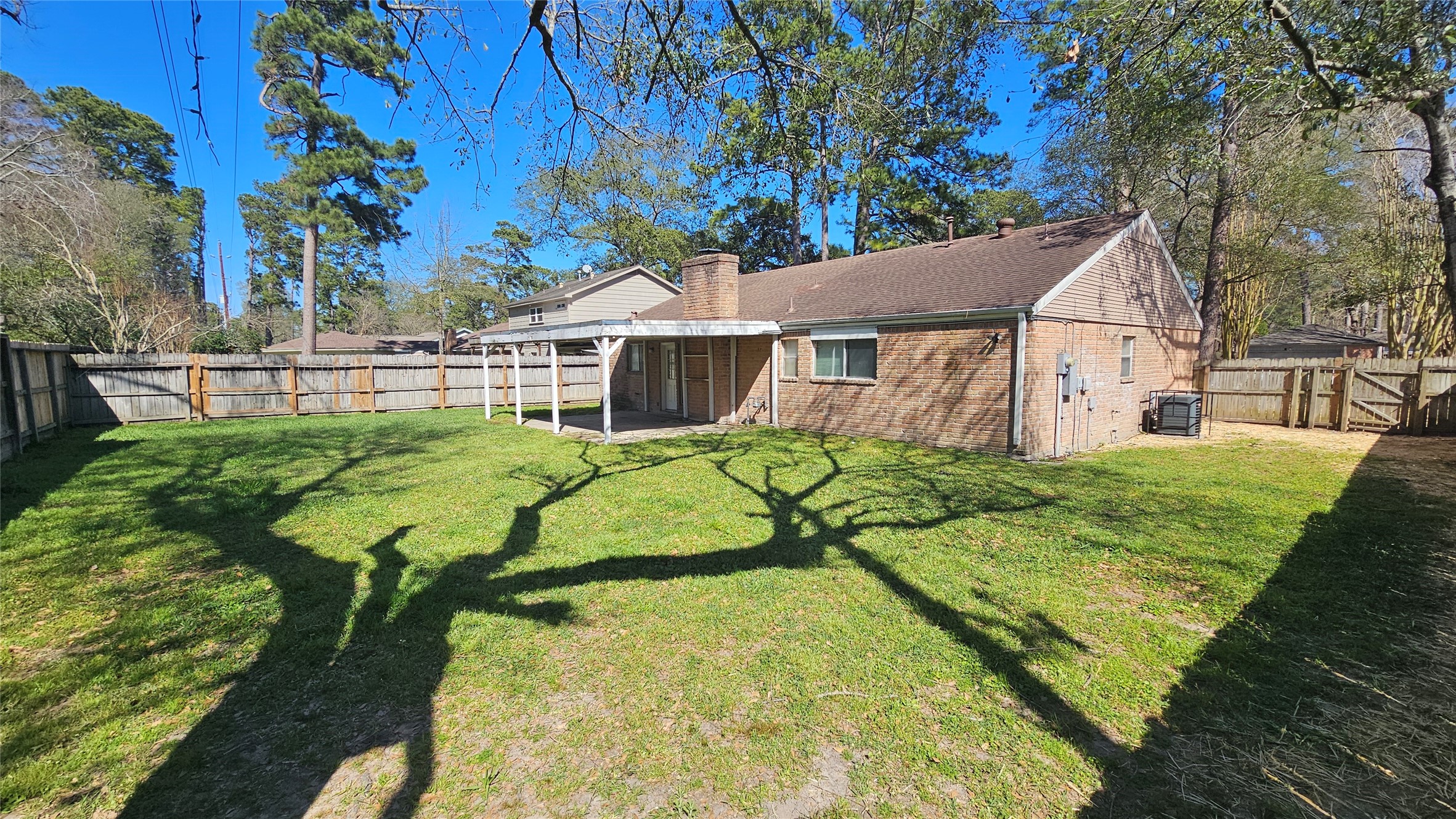 14807 Spring Lake Drive Houston, TX 77070 - Photo 21 of 21 a view of a house with a backyard