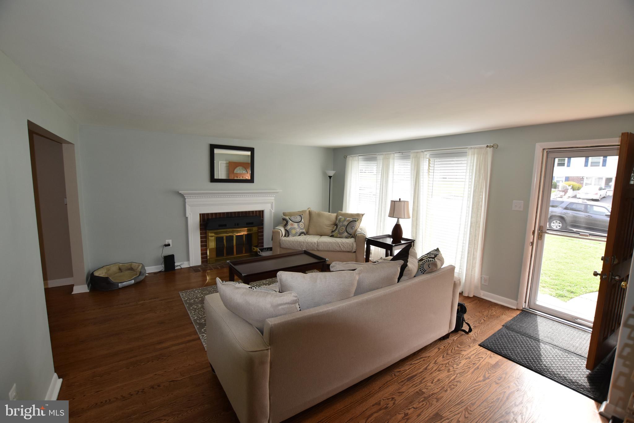 741 Rhoads Drive Springfield, PA 19064 - Photo 4 of 58 Living Room with Brick Fireplace & Mantle