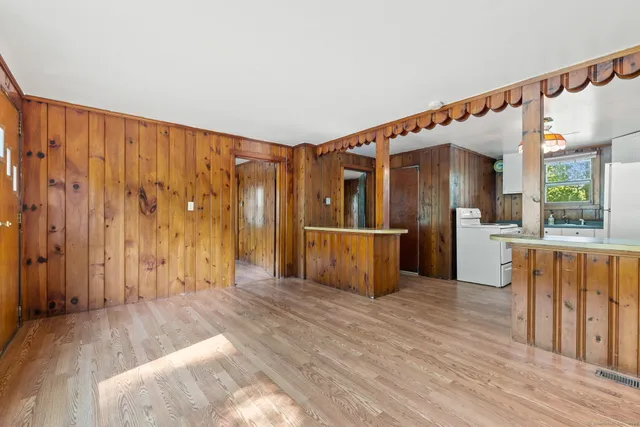 a view of kitchen with furniture and wooden floor
