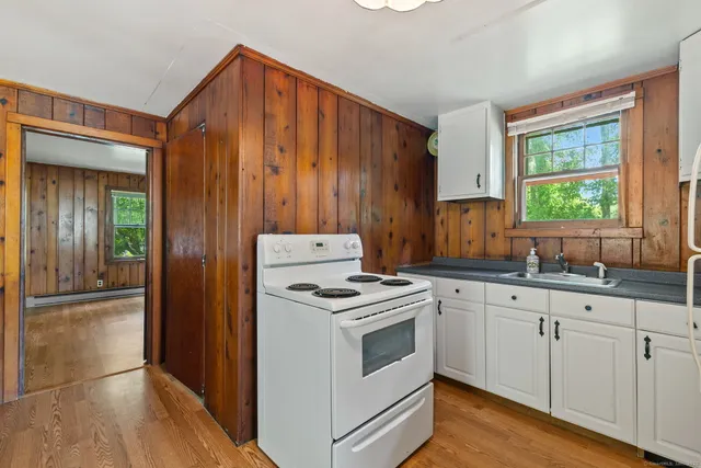 a kitchen with granite countertop cabinets stainless steel appliances and sink