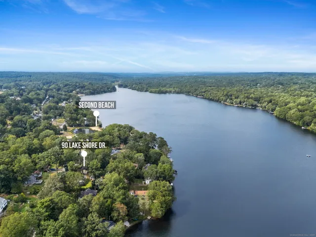 an aerial view of lake and mountain view
