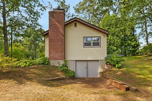 a front view of a house with garden