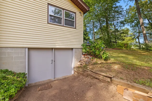 a view of a house with a yard and garage