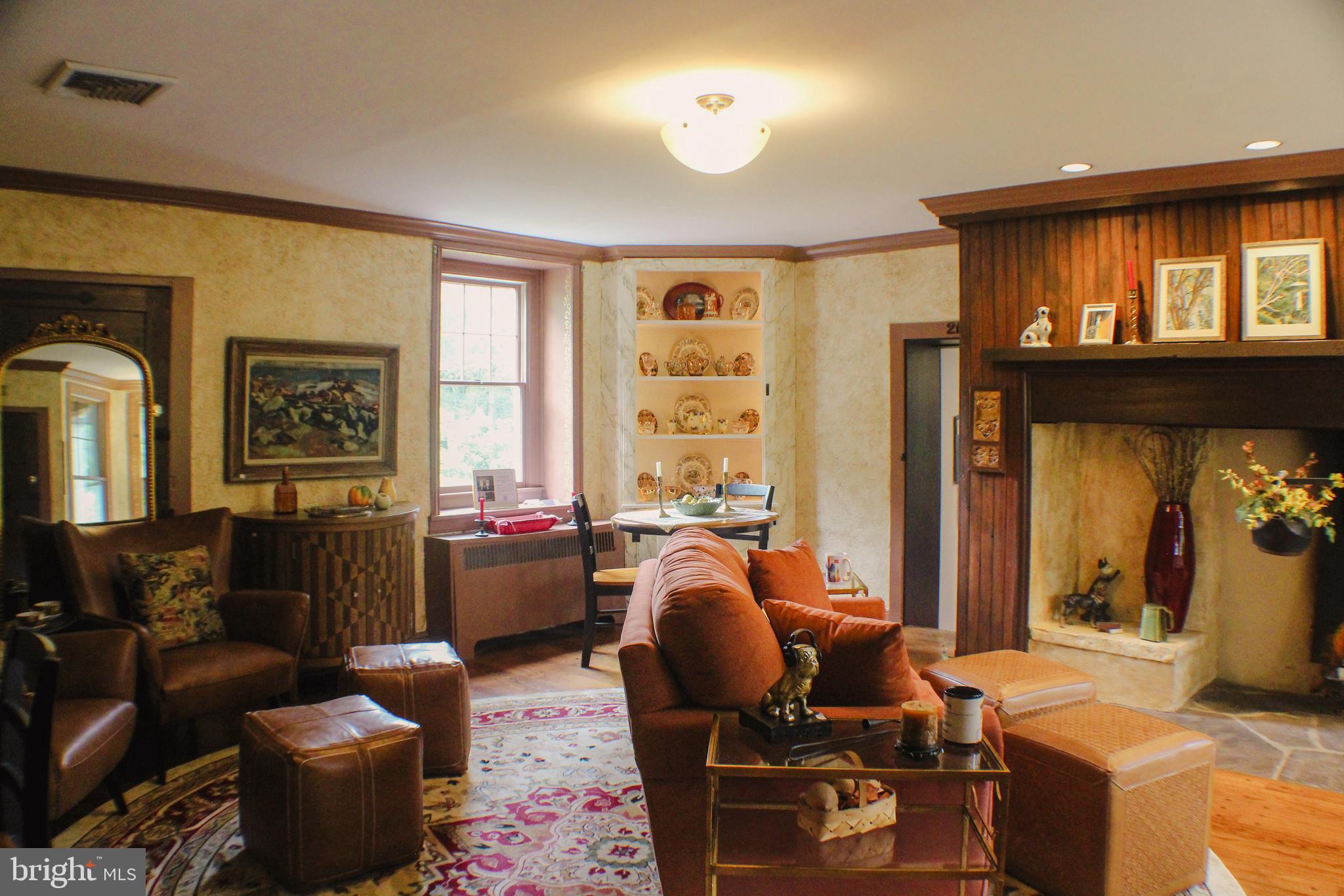 636 Almshouse Road Ivyland, PA 18974 - Photo 14 of 90 a living room with furniture a window and a flat screen tv