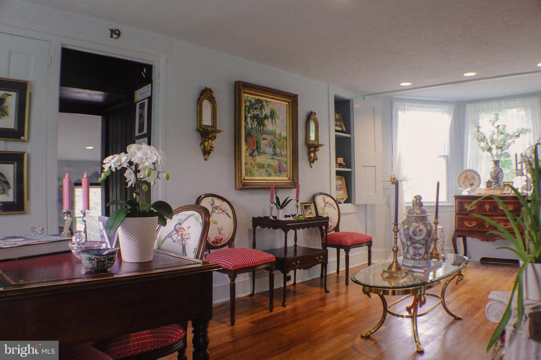 636 Almshouse Road Ivyland, PA 18974 - Photo 19 of 90 a view of a dining room with furniture and wooden floor