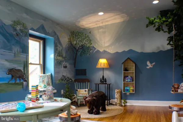 a balcony with wooden floor and outdoor seating