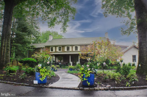 front view of a house with a bench