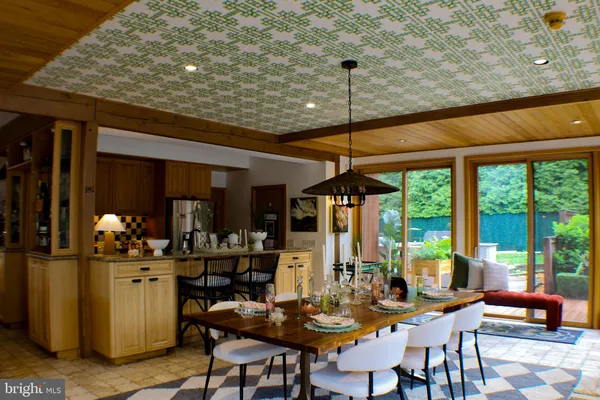 a bathroom with a sink mirror and toilet