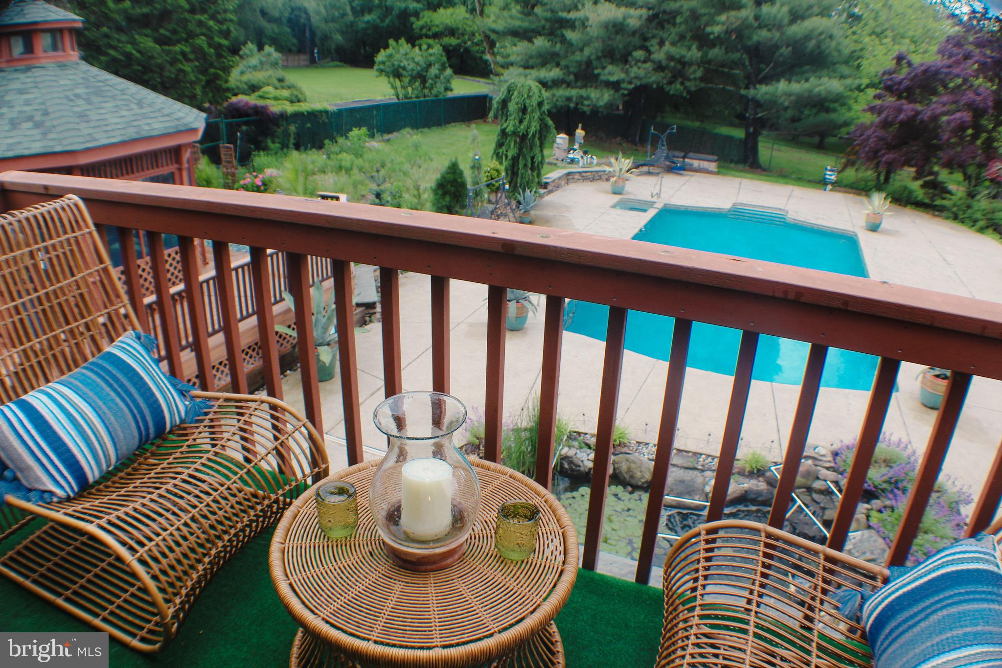 636 Almshouse Road Ivyland, PA 18974 - Photo 42 of 90 a balcony with wooden floor and outdoor seating