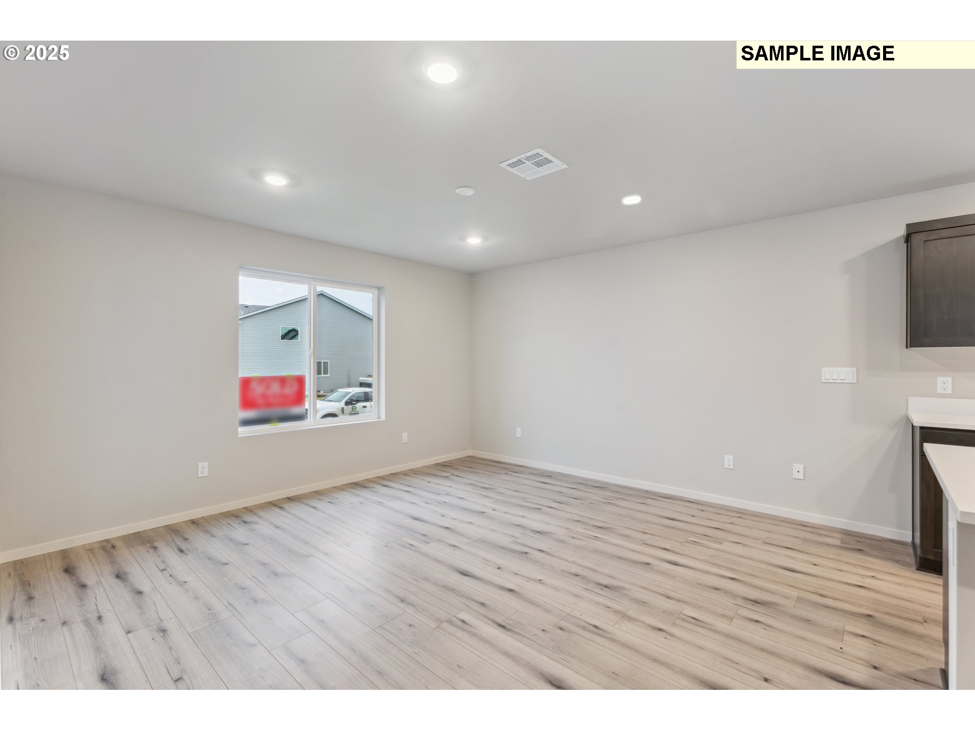 736 Merriott Lane Woodburn, OR 97071 - Photo 11 of 35 a view of an empty room with a flat screen tv