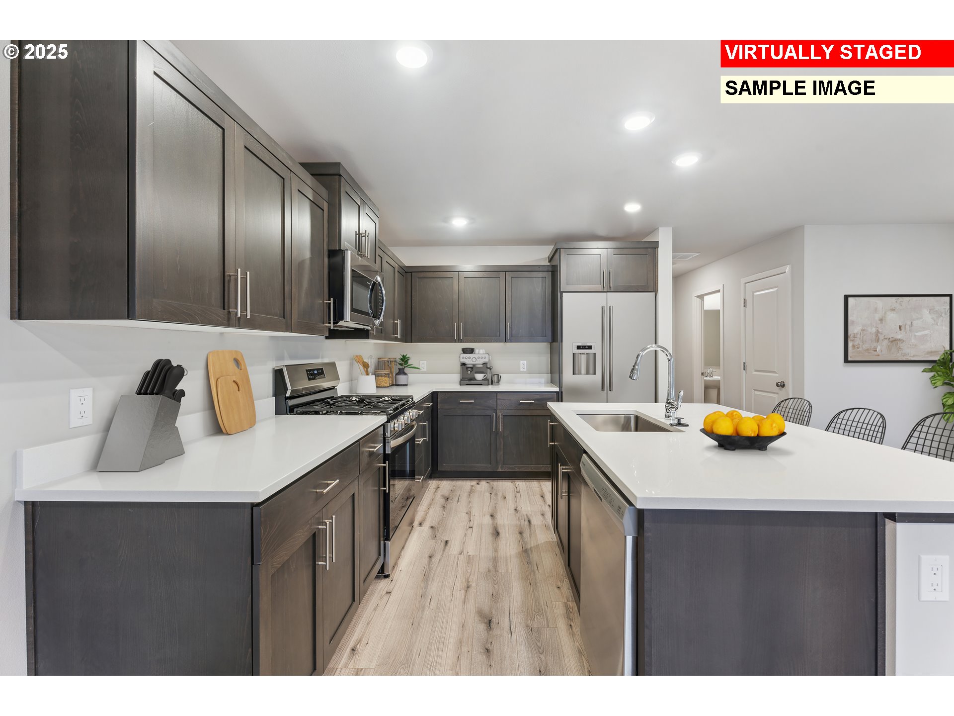 736 Merriott Lane Woodburn, OR 97071 - Photo 2 of 35 a kitchen with a sink a counter top space stainless steel appliances and cabinets