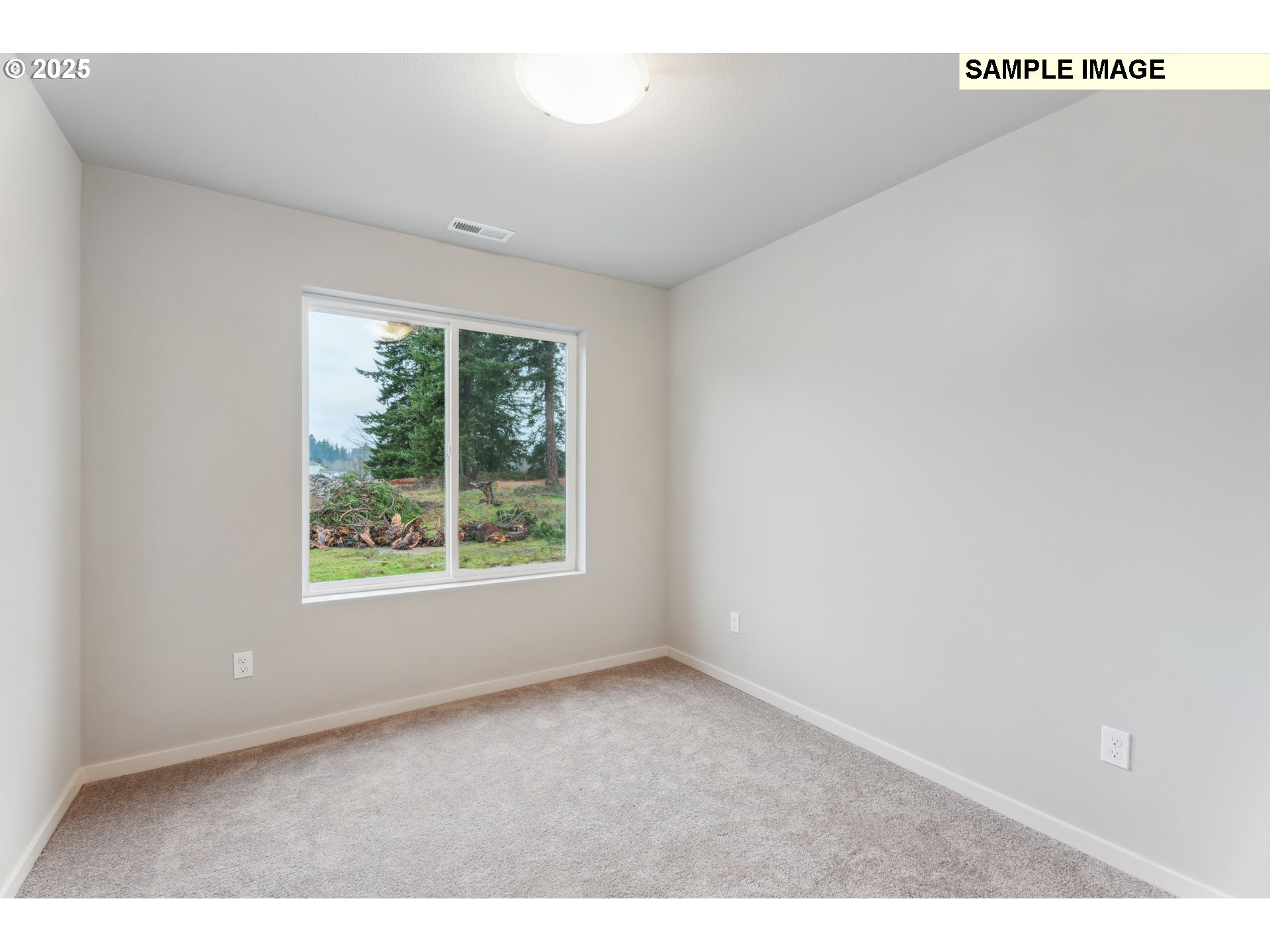 736 Merriott Lane Woodburn, OR 97071 - Photo 21 of 35 a view of an empty room with a window