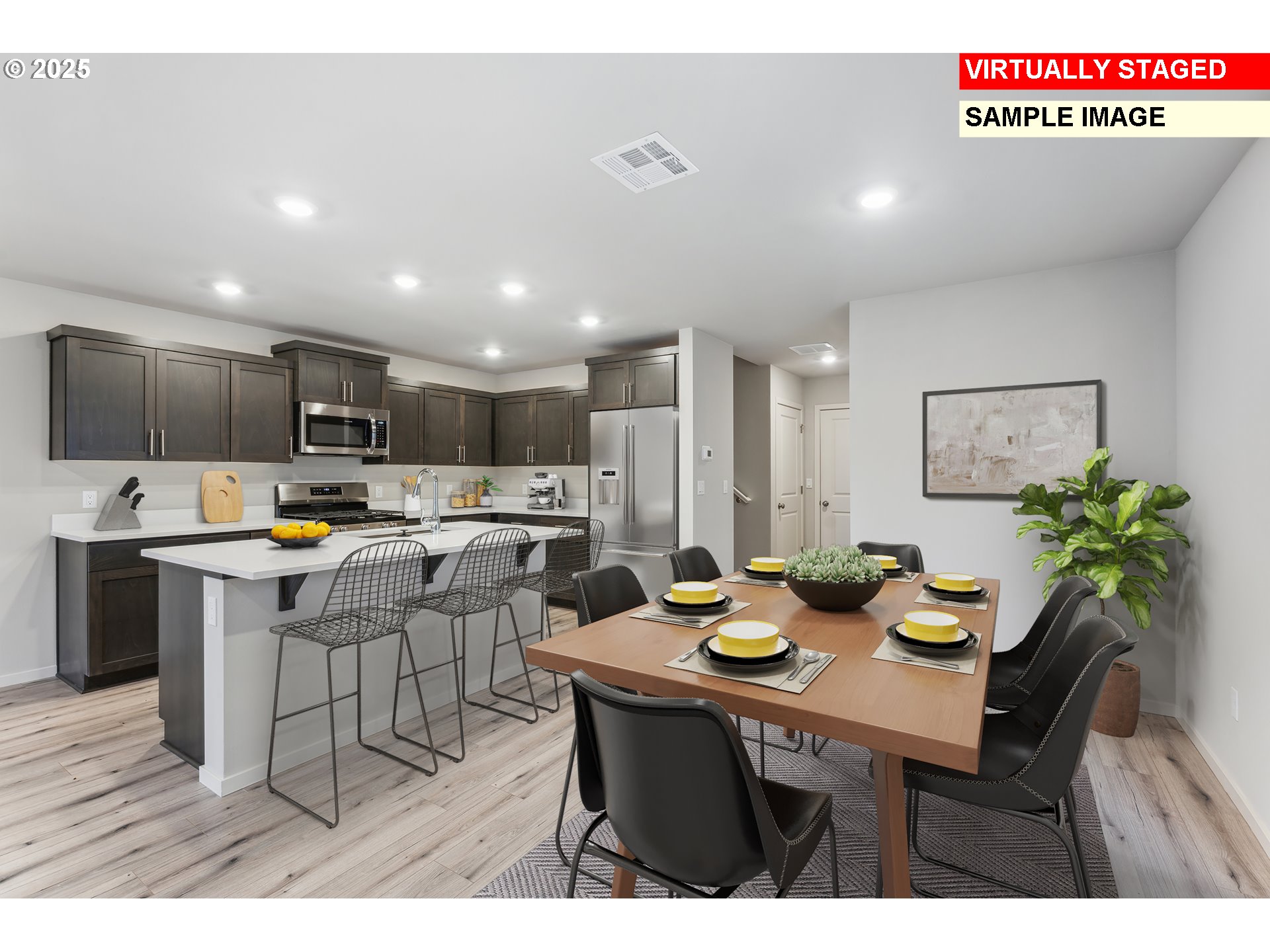 736 Merriott Lane Woodburn, OR 97071 - Photo 3 of 35 a kitchen with a table chairs refrigerator and microwave