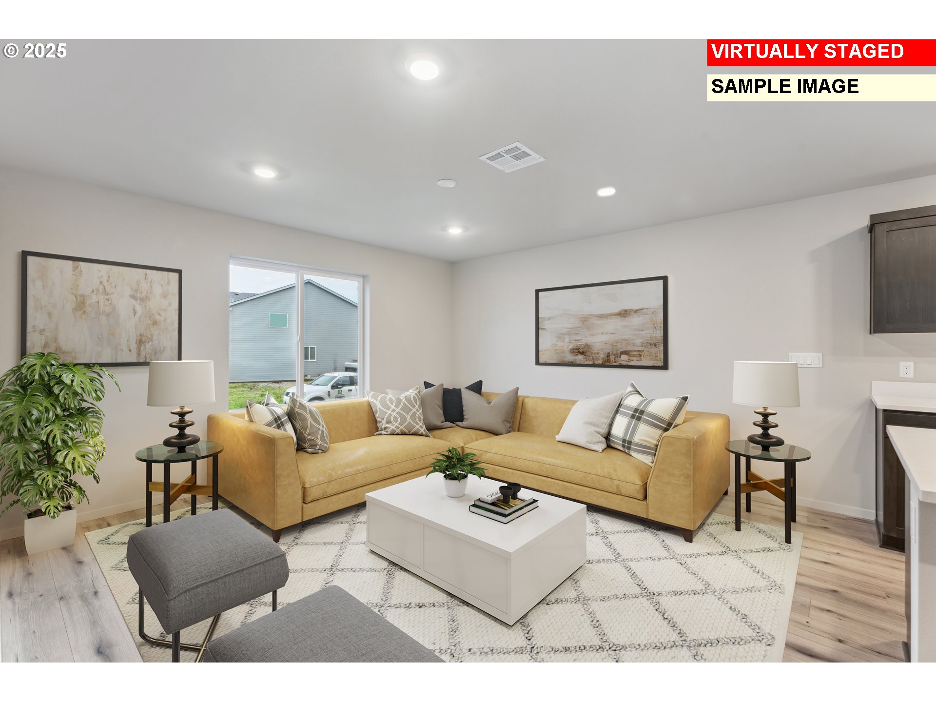 736 Merriott Lane Woodburn, OR 97071 - Photo 8 of 35 a living room with furniture a flat screen tv and a wall painting