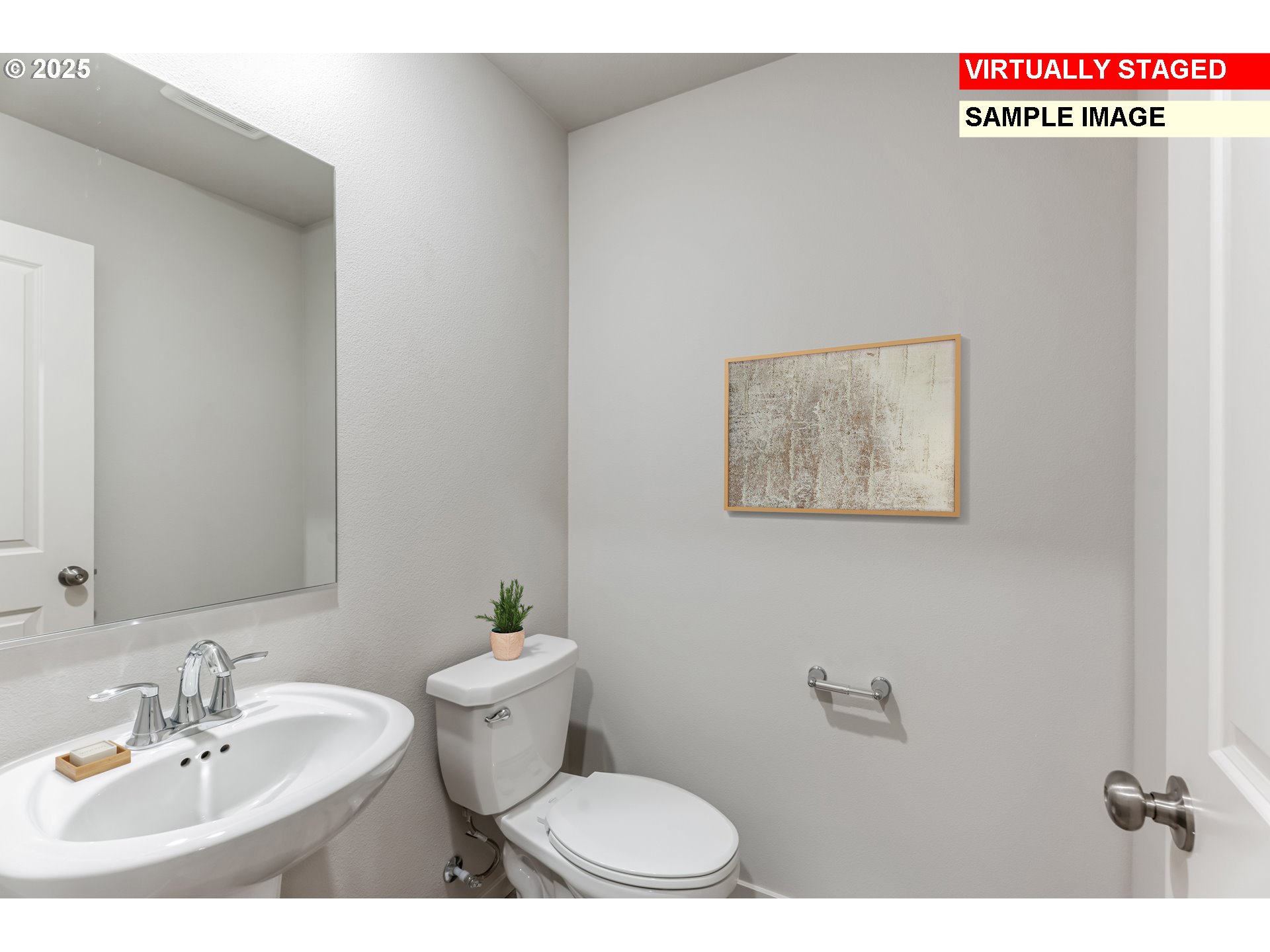 736 Merriott Lane Woodburn, OR 97071 - Photo 9 of 35 a bathroom with a toilet a sink and mirror