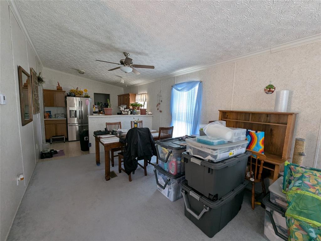 5139 Northeast Sandy Road Arcadia, FL 34266 - Photo 11 of 45 a room with furniture a fireplace and a chandelier
