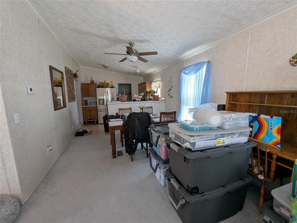 5139 Northeast Sandy Road Arcadia, FL 34266 - Photo 15 of 45 a room with stainless steel appliances lots of furniture and clutter