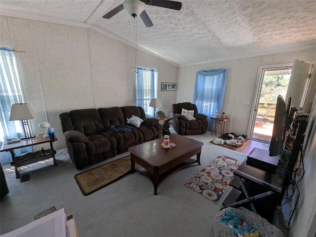 5139 Northeast Sandy Road Arcadia, FL 34266 - Photo 16 of 45 a living room with furniture or couch and a window