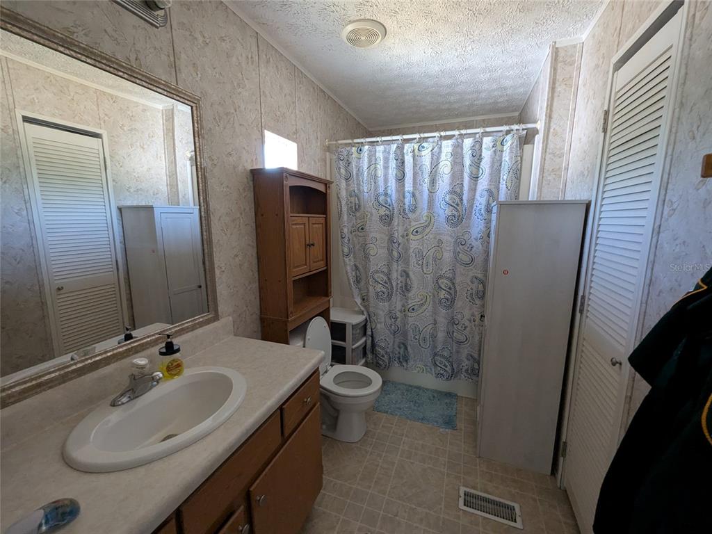 5139 Northeast Sandy Road Arcadia, FL 34266 - Photo 27 of 45 a bathroom with a sink toilet and shower