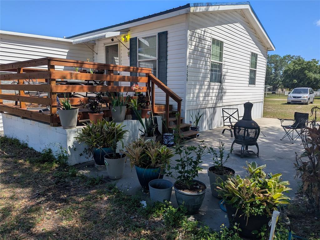 5139 Northeast Sandy Road Arcadia, FL 34266 - Photo 3 of 45 a group of people sitting in front of a house