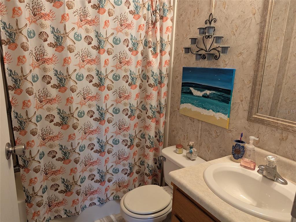 5139 Northeast Sandy Road Arcadia, FL 34266 - Photo 31 of 45 a bathroom with a sink toilet and mirror