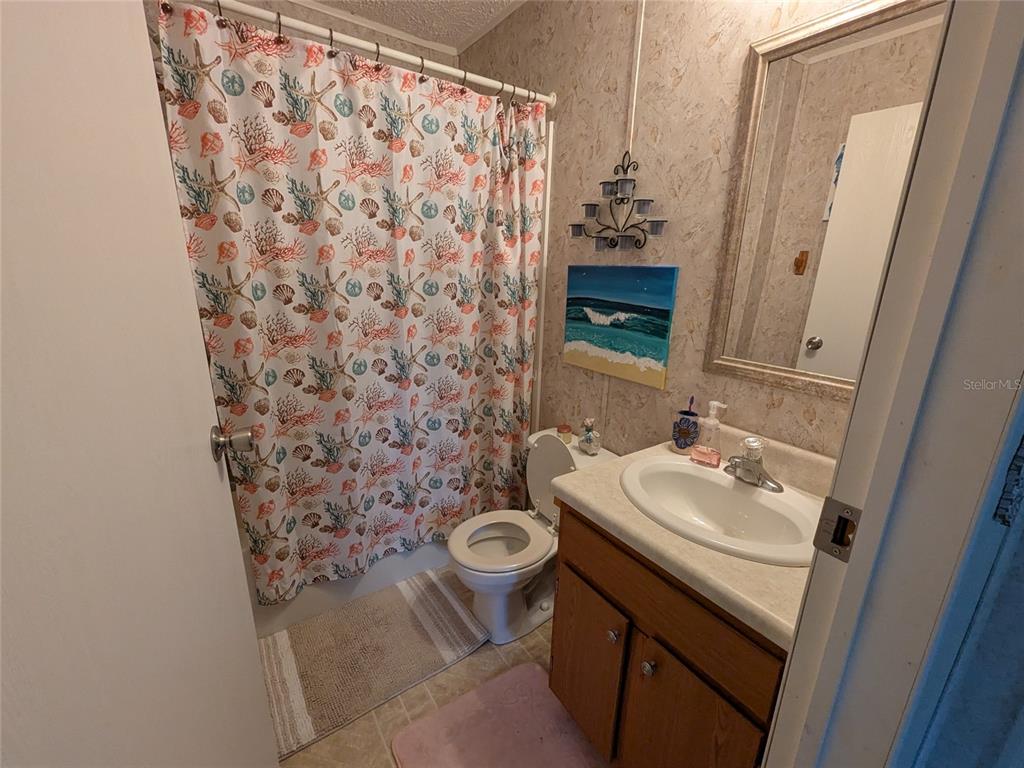5139 Northeast Sandy Road Arcadia, FL 34266 - Photo 32 of 45 a bathroom with a sink toilet and mirror