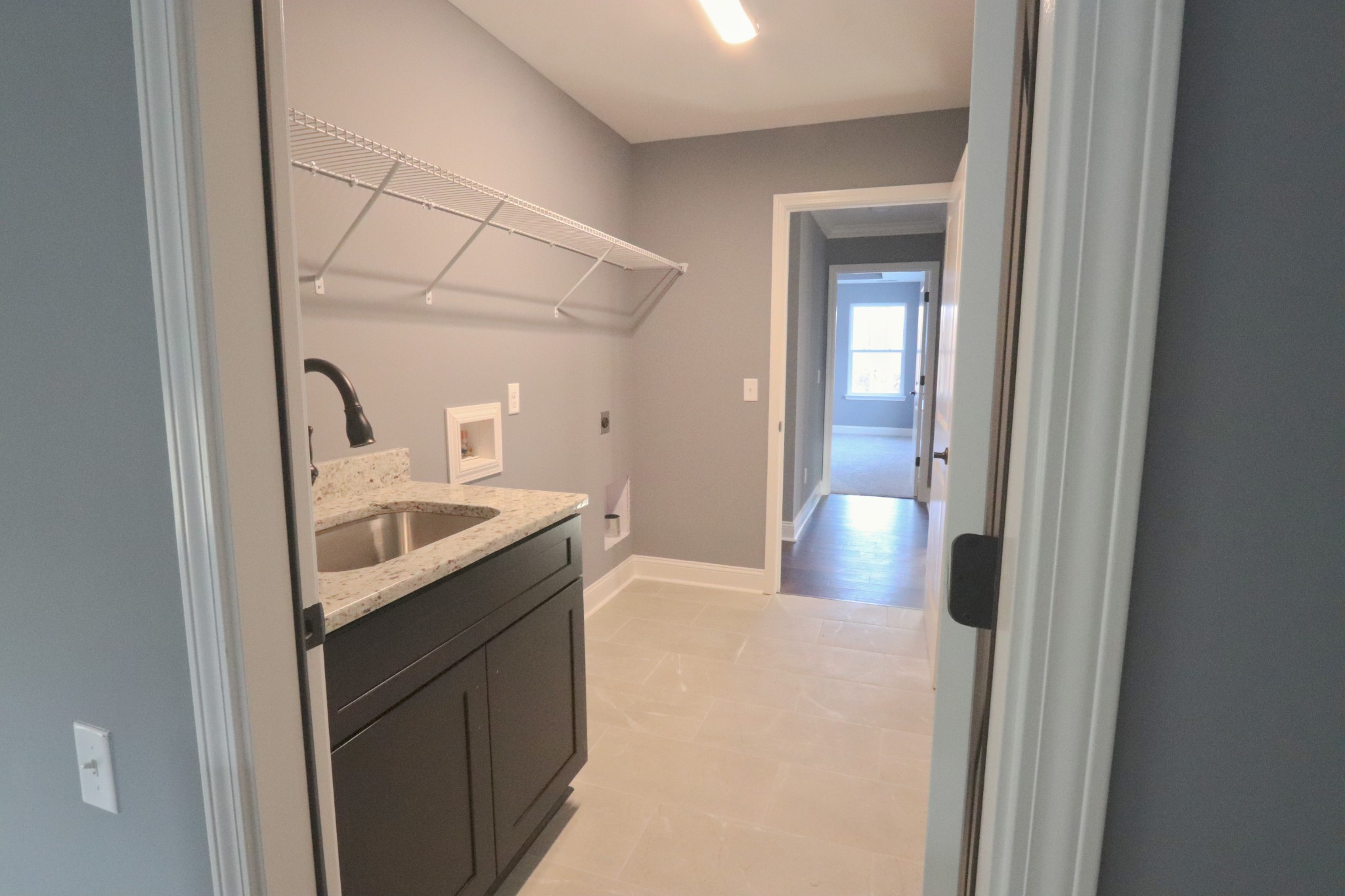 250 Still Point Road Smithville, TN 37166 - Photo 16 of 30 a kitchen with a sink a stove and cabinets
