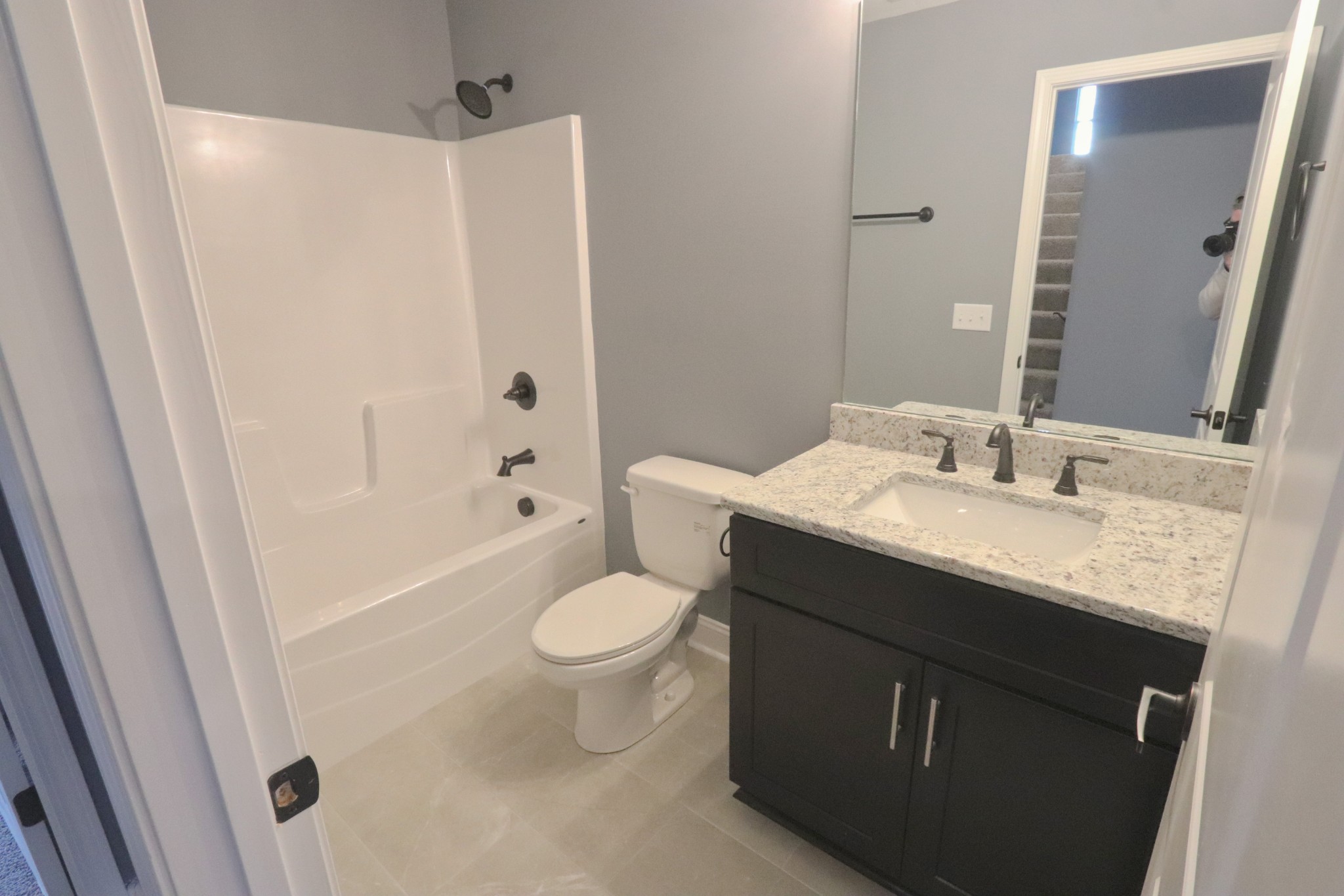 250 Still Point Road Smithville, TN 37166 - Photo 17 of 30 a bathroom with a granite countertop sink toilet and shower