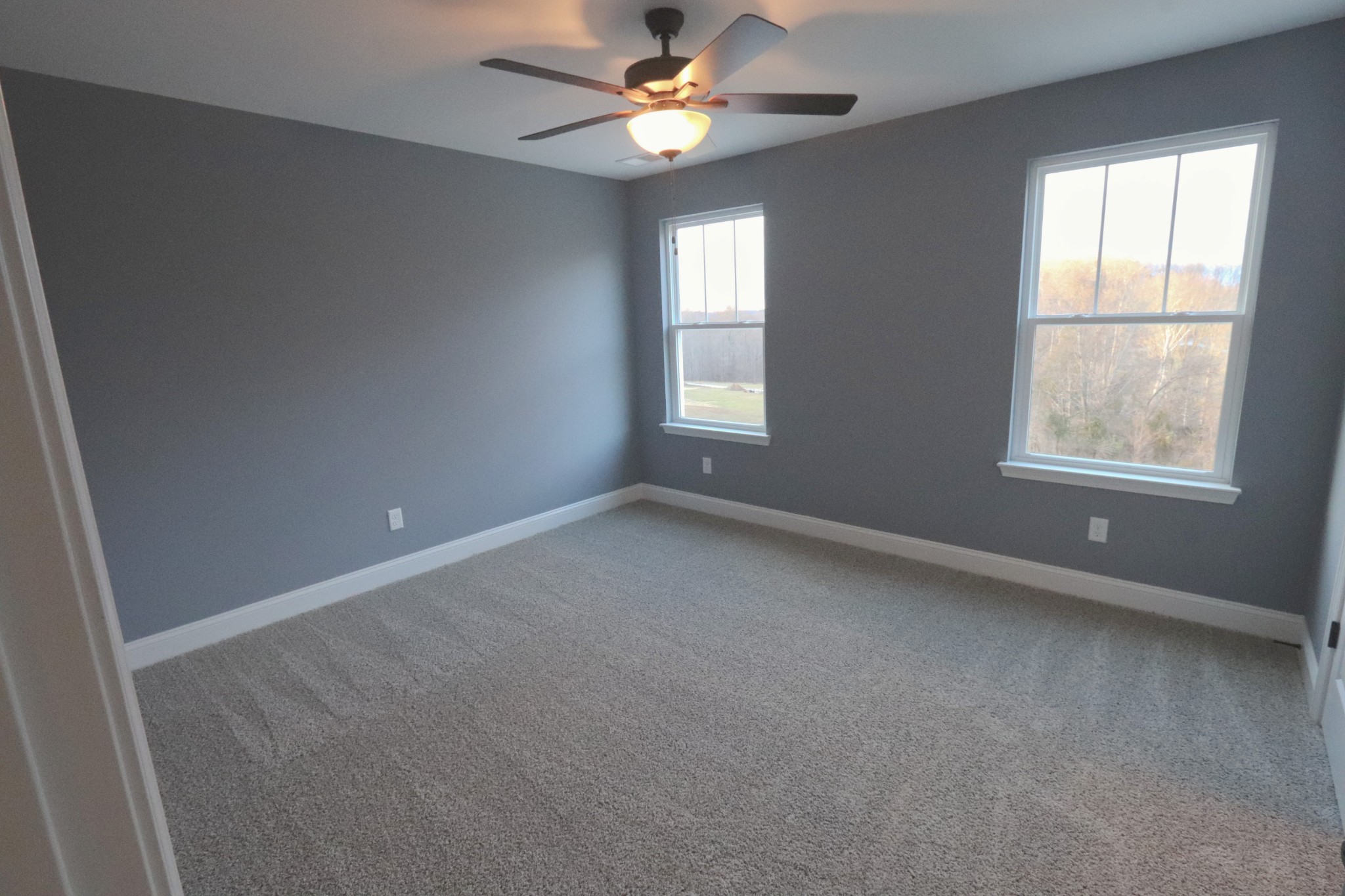 250 Still Point Road Smithville, TN 37166 - Photo 18 of 30 an empty room with a window and a fan
