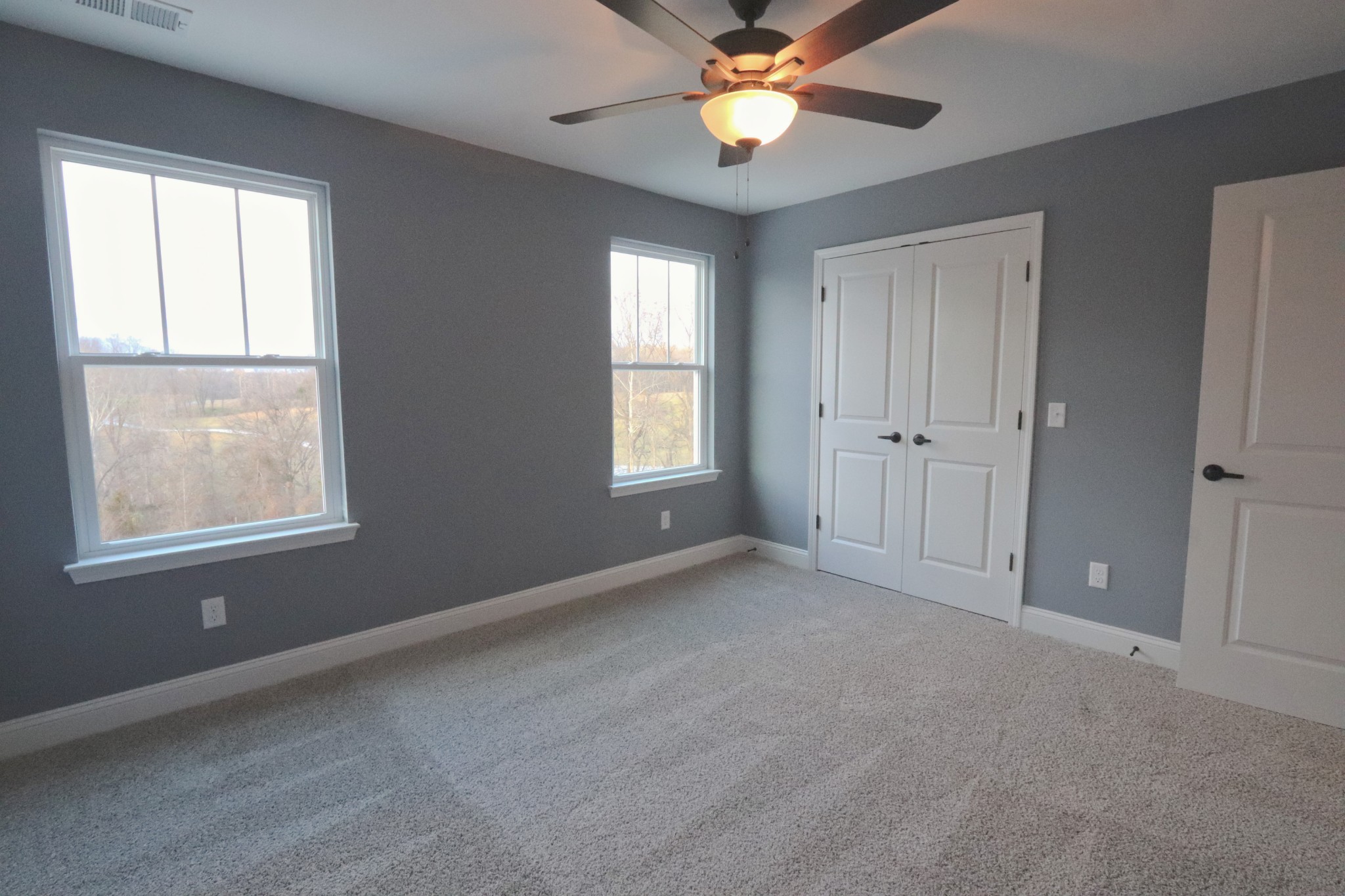 250 Still Point Road Smithville, TN 37166 - Photo 19 of 30 an empty room with windows and fan
