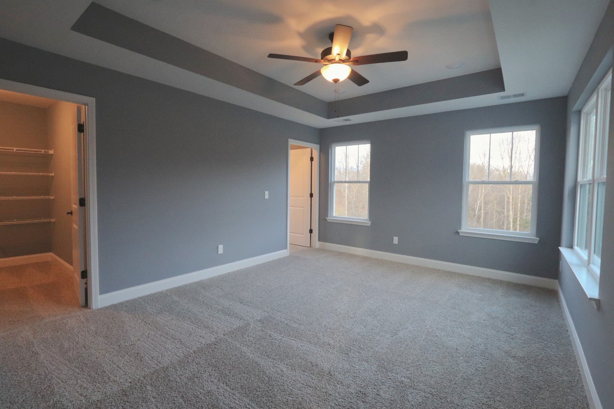 250 Still Point Road Smithville, TN 37166 - Photo 23 of 30 an empty room with chandelier fan and windows