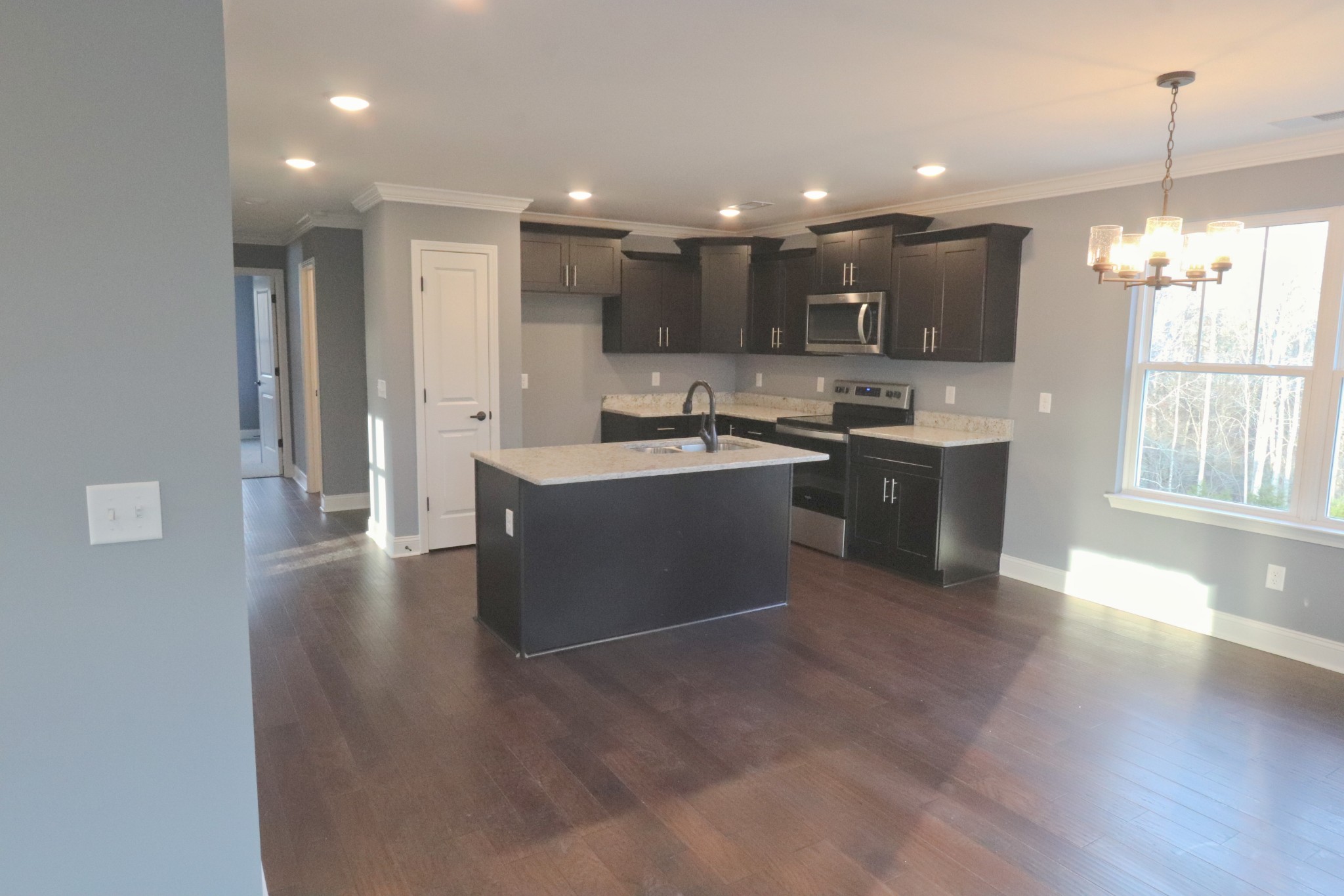 250 Still Point Road Smithville, TN 37166 - Photo 9 of 30 a kitchen with stainless steel appliances granite countertop a sink and cabinets
