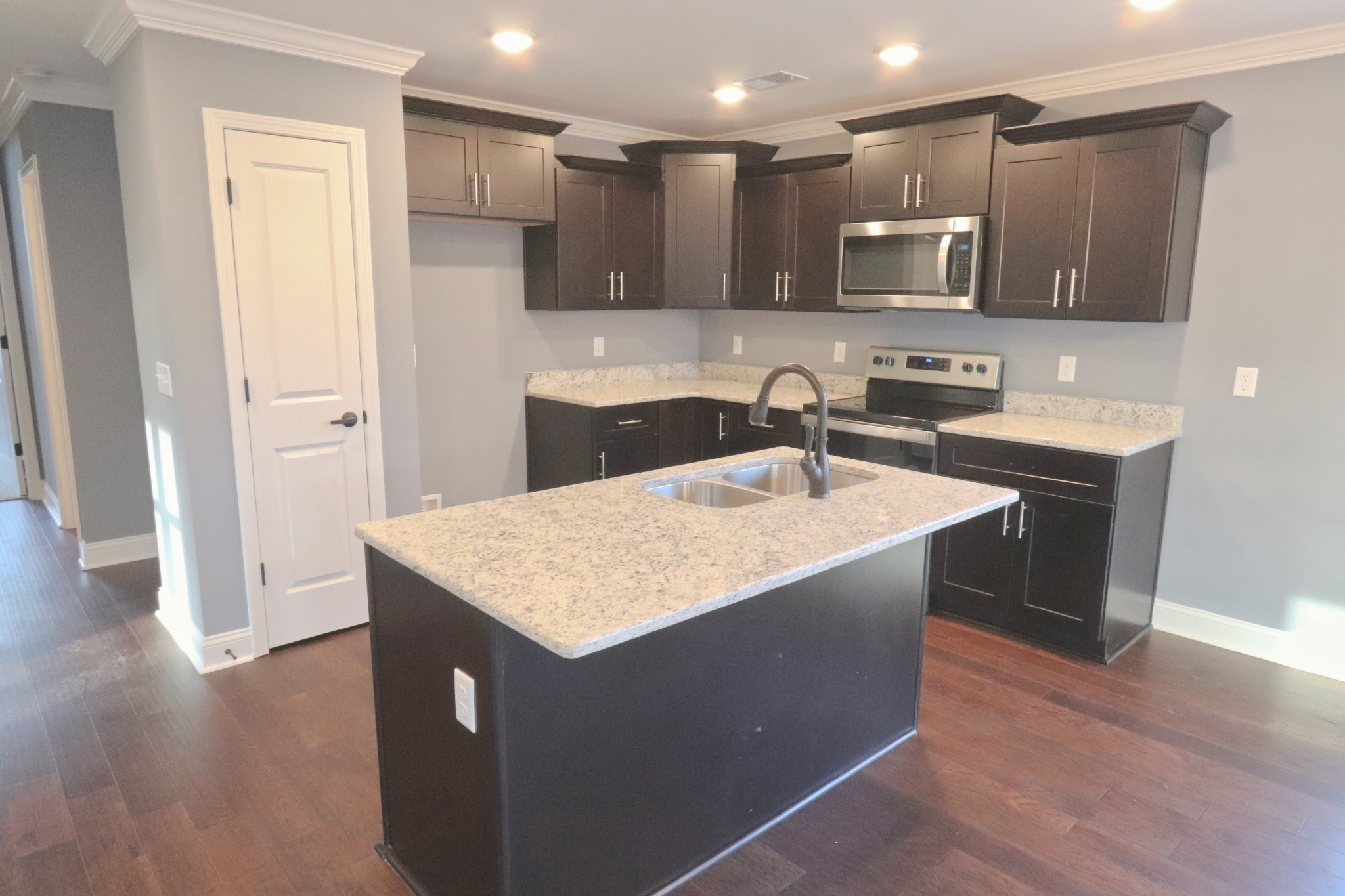 250 Still Point Road Smithville, TN 37166 - Photo 10 of 30 a kitchen with stainless steel appliances a sink a stove a microwave a refrigerator a window