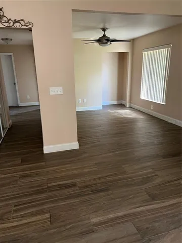 a view of a livingroom with wooden floor