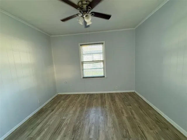 a kitchen with a refrigerator a stove top oven and a window