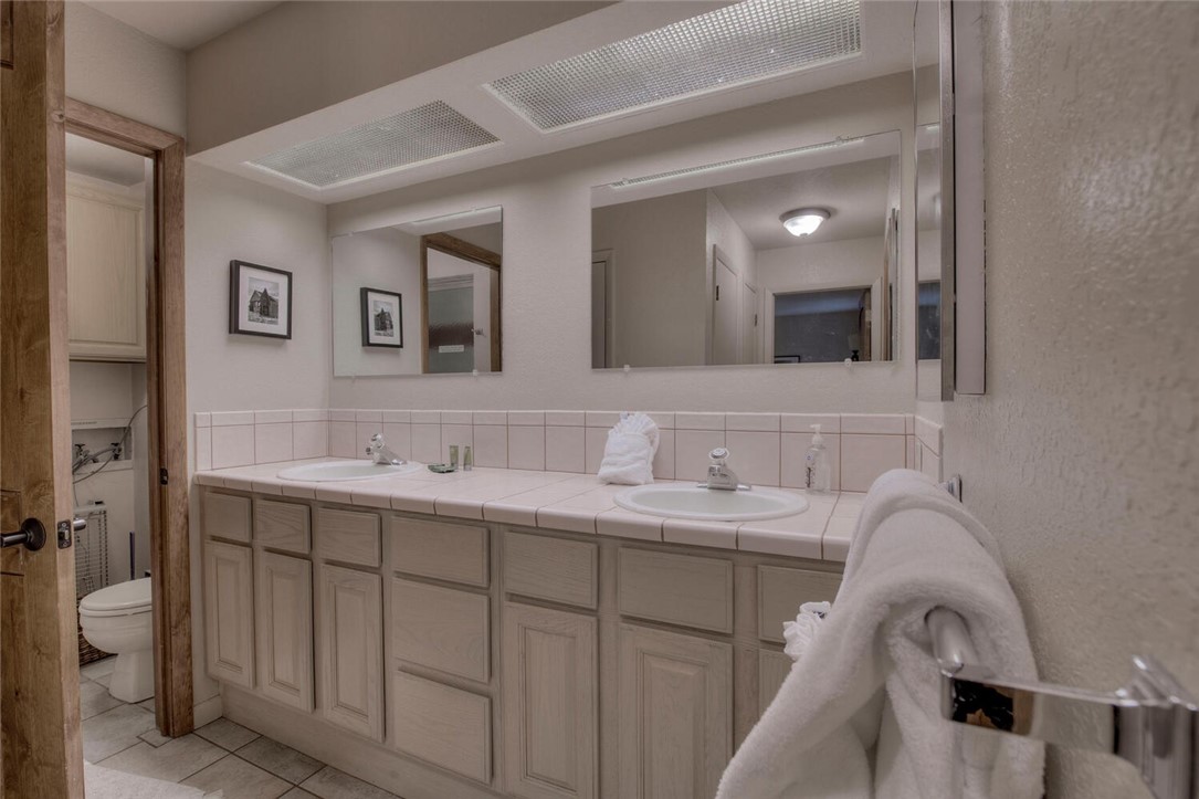 325 Four Oclock Road, Unit 301 Breckenridge, CO 80424 - Photo 12 of 17 Bathroom with 2 sinks