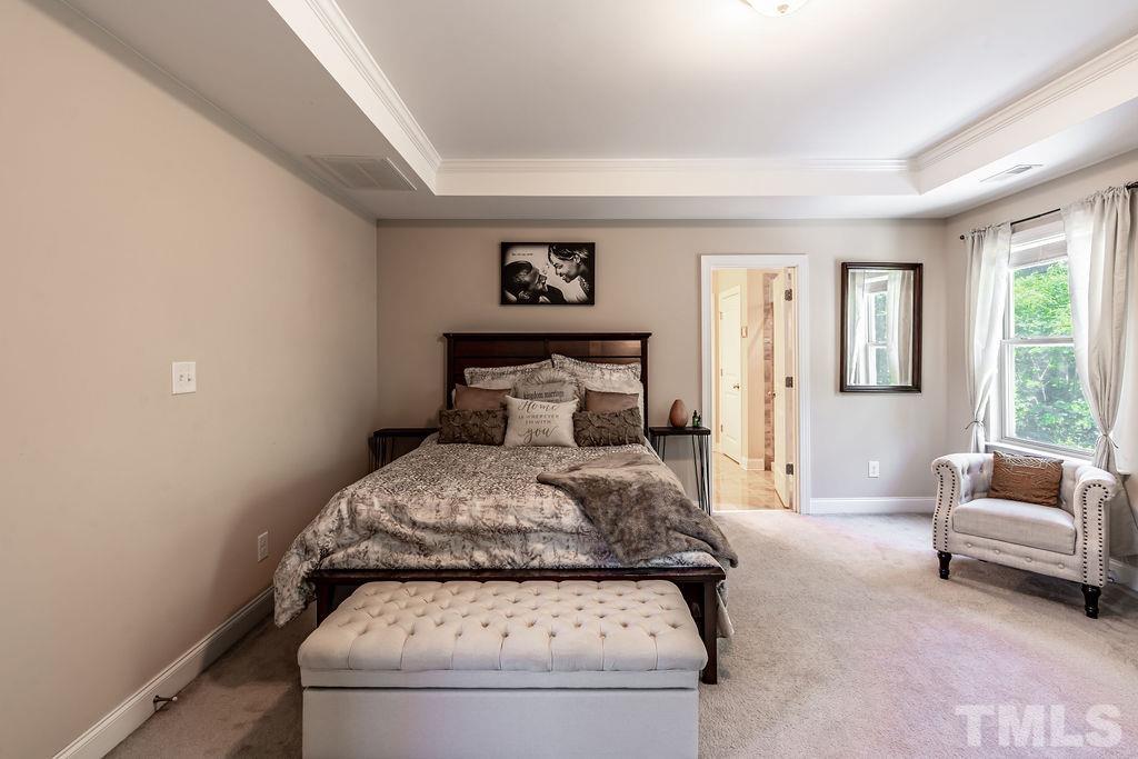 3578 Eastern Branch Road Raleigh, NC 27610 - Photo 14 of 24 a bedroom with a bed and a couch
