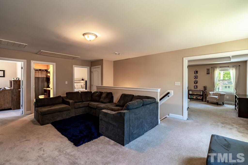 3578 Eastern Branch Road Raleigh, NC 27610 - Photo 20 of 24 a living room with furniture and a couch